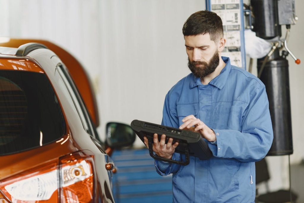 A mechanic fixing a car