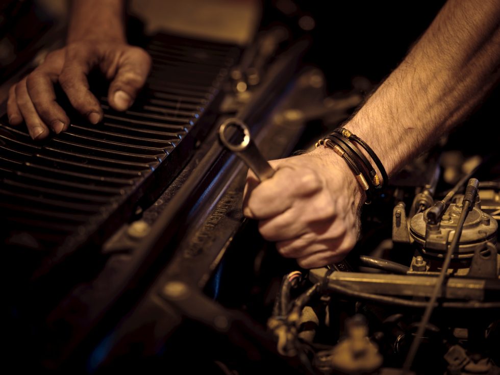 A mechanic repairing a car